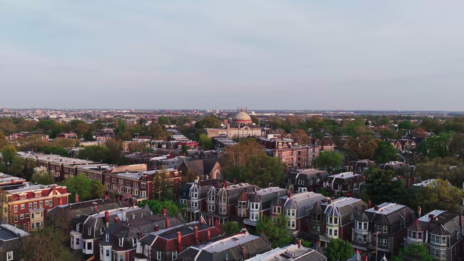 Golden hour aerial over Philadelphia rowhome neighborhoods